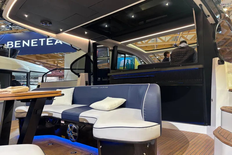  Yacht Photos Pics 2025 Beneteau Gran Turismo 50 yacht interior with modern seating and ambient lighting.