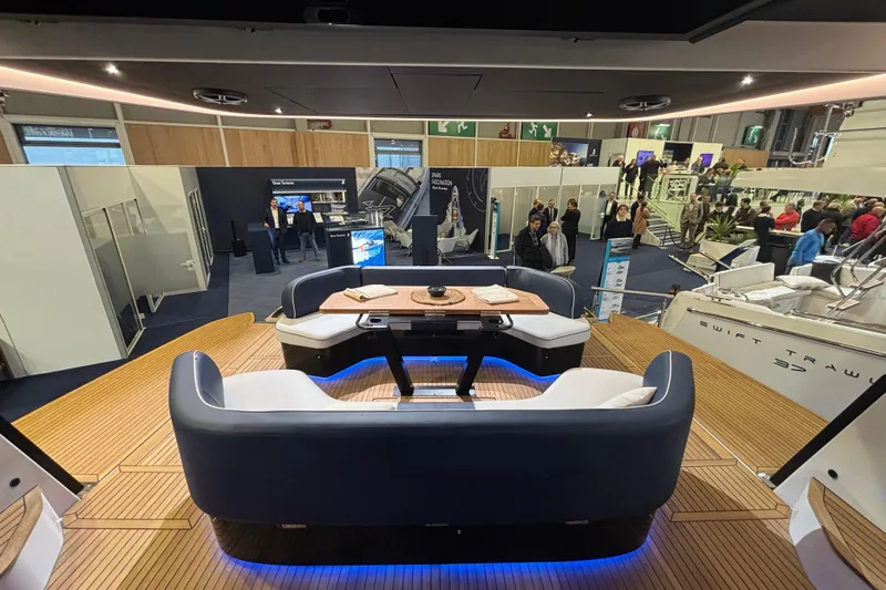  Yacht Photos Pics Luxurious interior of 2025 Beneteau Gran Turismo 50 yacht at a boat show.