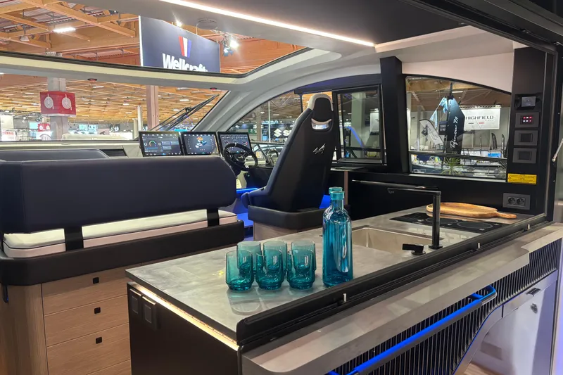  Yacht Photos Pics Interior of 2025 Beneteau Gran Turismo 50 yacht with modern kitchen and helm.