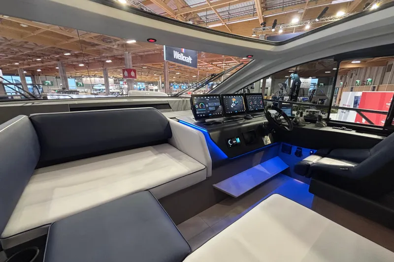  Yacht Photos Pics Interior of 2025 Beneteau Gran Turismo 50 yacht with modern cockpit and seating.