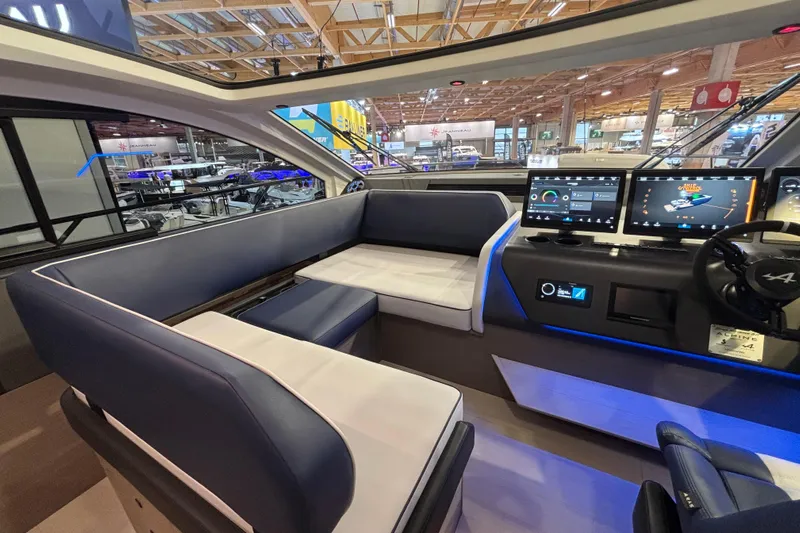  Yacht Photos Pics Interior of 2025 Beneteau Gran Turismo 50 yacht with modern seating and advanced navigation displays.