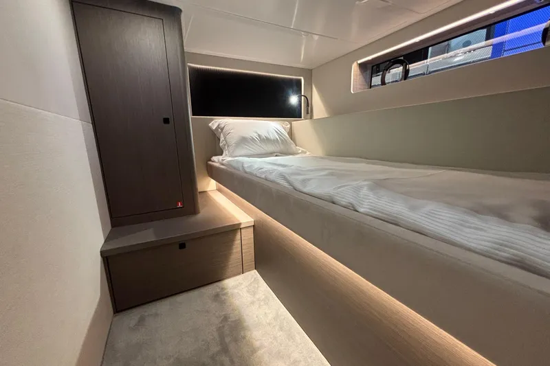  Yacht Photos Pics 2025 Beneteau Gran Turismo 50 cabin interior with single bed and modern design.
