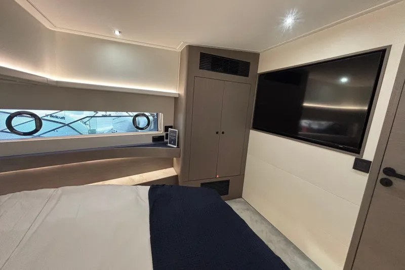  Yacht Photos Pics Luxurious interior of 2025 Beneteau Gran Turismo 50 yacht cabin with modern amenities.