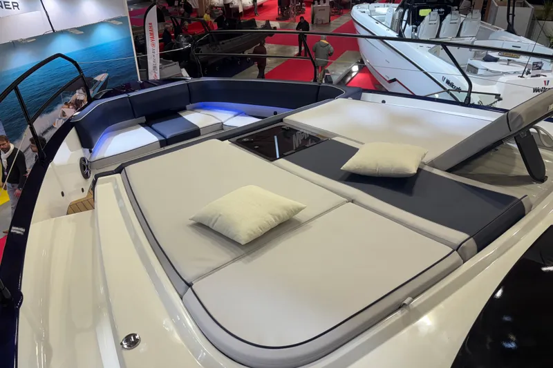  Yacht Photos Pics 2025 Beneteau Gran Turismo 50 yacht with luxurious sunbathing area and cushions.