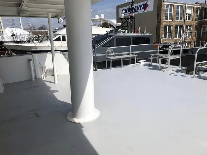 Care Bear Yacht Photos Pics Deck of 2013 Ocean Voyager 95 EXPEDITION yacht in marina.