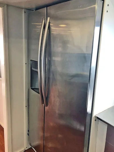 Care Bear Yacht Photos Pics Stainless steel refrigerator in 2013 Ocean Voyager 95 EXPEDITION yacht kitchen.