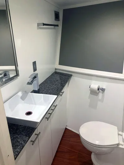 Care Bear Yacht Photos Pics Modern bathroom in 2013 Ocean Voyager 95 EXPEDITION yacht with sleek fixtures and granite countertop.