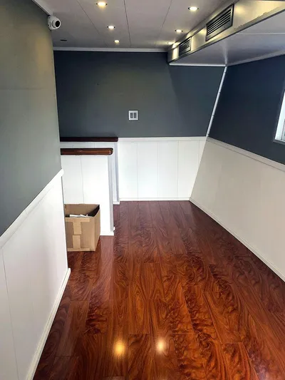 Care Bear Yacht Photos Pics Interior of 2013 Ocean Voyager 95 EXPEDITION with wood flooring and modern design.