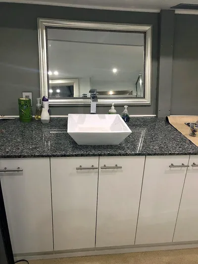 Care Bear Yacht Photos Pics Modern bathroom vanity on Ocean Voyager 95 EXPEDITION 2013 yacht with granite countertop and vessel sink.