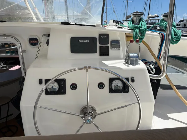 Windborne Yacht Photos Pics Helm of 2015 Voyage Yachts VOYAGE 520 with navigation instruments and steering wheel.