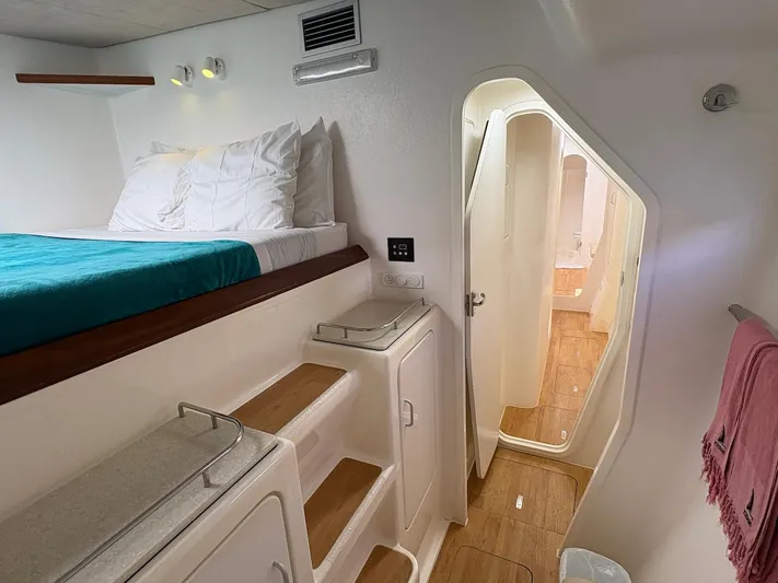 Windborne Yacht Photos Pics Interior cabin of 2015 Voyage Yachts VOYAGE 520 with bed and wooden steps.