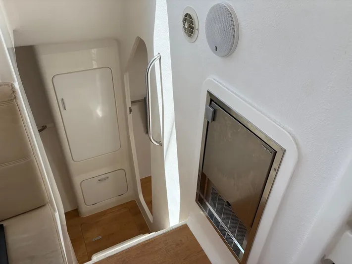 Windborne Yacht Photos Pics Interior of 2015 Voyage Yachts VOYAGE 520, featuring sleek white walls and wooden flooring.