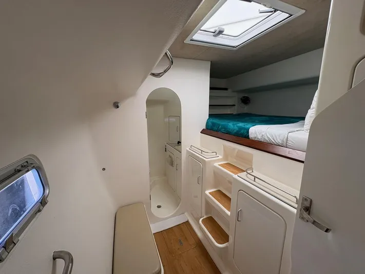 Windborne Yacht Photos Pics Interior cabin of 2015 Voyage Yachts VOYAGE 520, featuring bed, storage, and skylight.