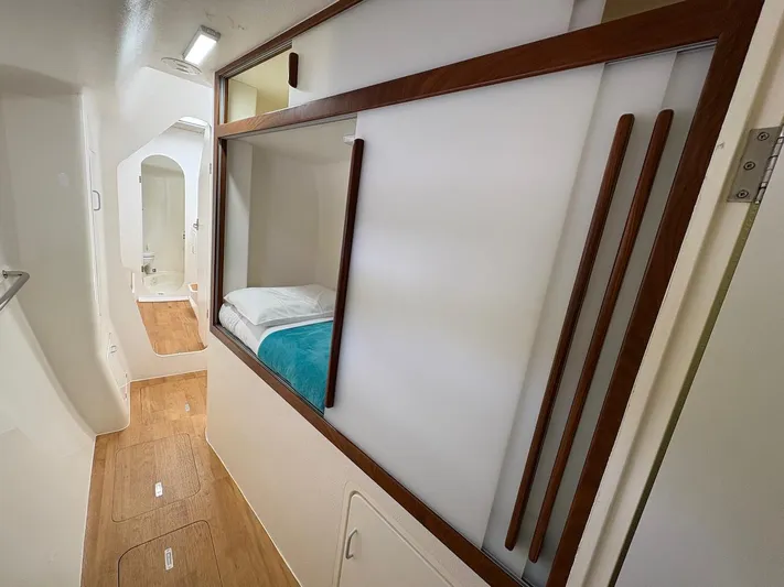 Windborne Yacht Photos Pics Interior of 2015 Voyage Yachts VOYAGE 520, featuring a cozy cabin with modern design.