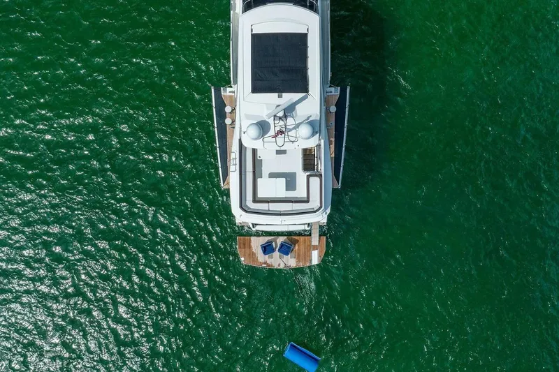  Yacht Photos Pics Aerial view of 2019 Galeon 640 Fly yacht on vibrant green water.