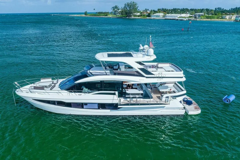  Yacht Photos Pics 2019 Galeon 640 Fly yacht on clear blue water, showcasing luxury design.