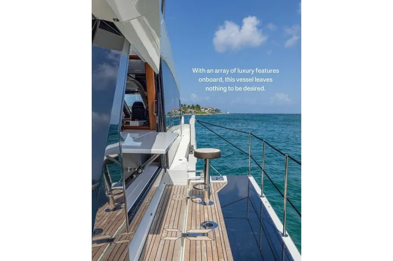  Yacht Photos Pics 2019 Galeon 640 Fly yacht with luxury features, cruising on clear blue waters.