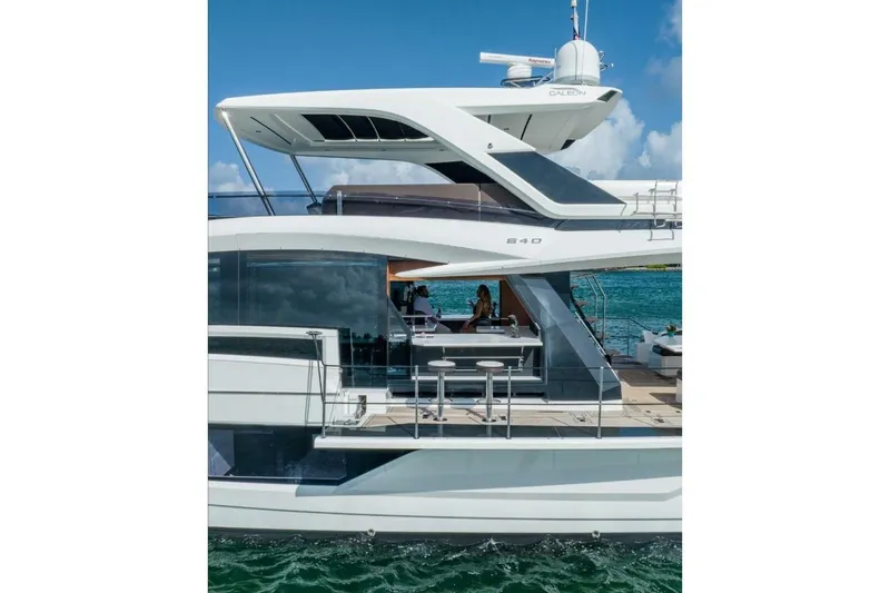  Yacht Photos Pics 2019 Galeon 640 Fly yacht on water, featuring sleek design and modern amenities.