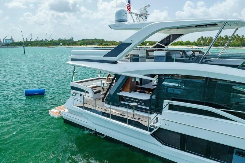  Yacht Photos Pics 2019 Galeon 640 Fly yacht on turquoise water, showcasing sleek design and luxury features.