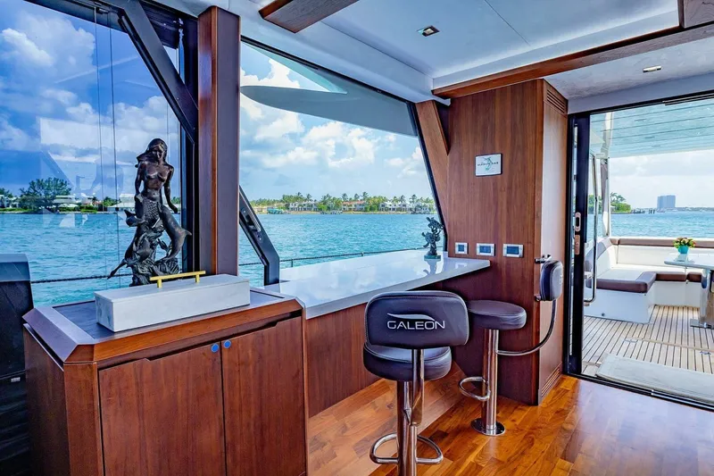  Yacht Photos Pics Luxurious interior of 2019 Galeon 640 Fly yacht with ocean view and elegant decor.