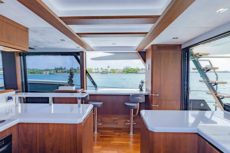  Yacht Photos Pics Luxurious interior of 2019 Galeon 640 Fly yacht with modern design and waterfront view.
