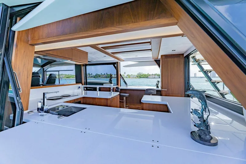  Yacht Photos Pics Luxurious interior of 2019 Galeon 640 Fly yacht with modern kitchen and ocean view.
