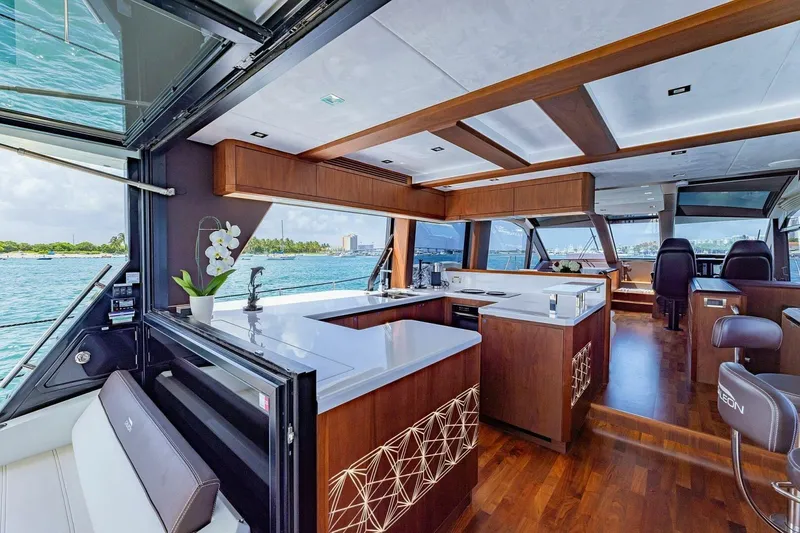  Yacht Photos Pics Luxurious interior of 2019 Galeon 640 Fly yacht with modern kitchen and ocean view.