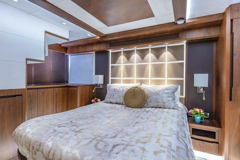  Yacht Photos Pics Luxurious bedroom interior of 2019 Galeon 640 Fly yacht with modern wood finishes.