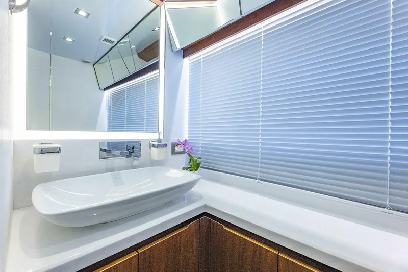  Yacht Photos Pics Luxurious bathroom interior of 2019 Galeon 640 Fly yacht with modern sink and blinds.