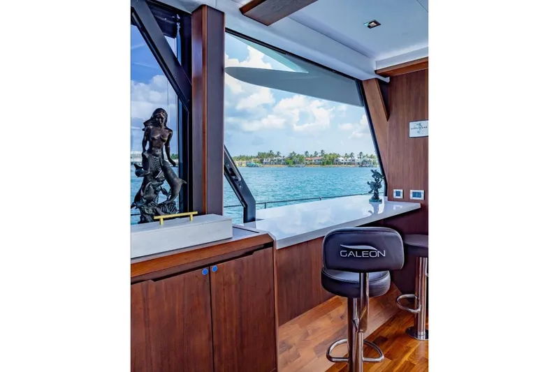  Yacht Photos Pics Luxurious interior of 2019 Galeon 640 Fly yacht with ocean view and elegant decor.