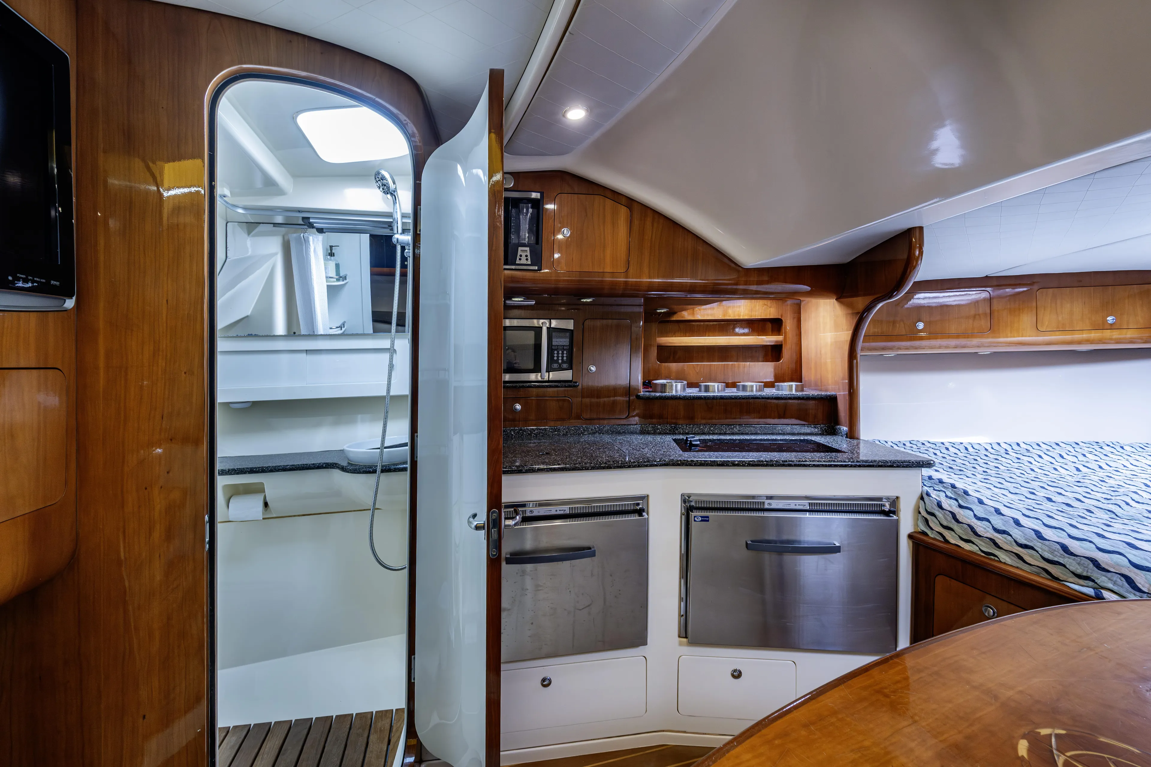 5 O' Clock Somewhere Yacht Photos Pics Luxurious interior of 2010 Scout 350 Abaco boat with kitchen and bathroom.