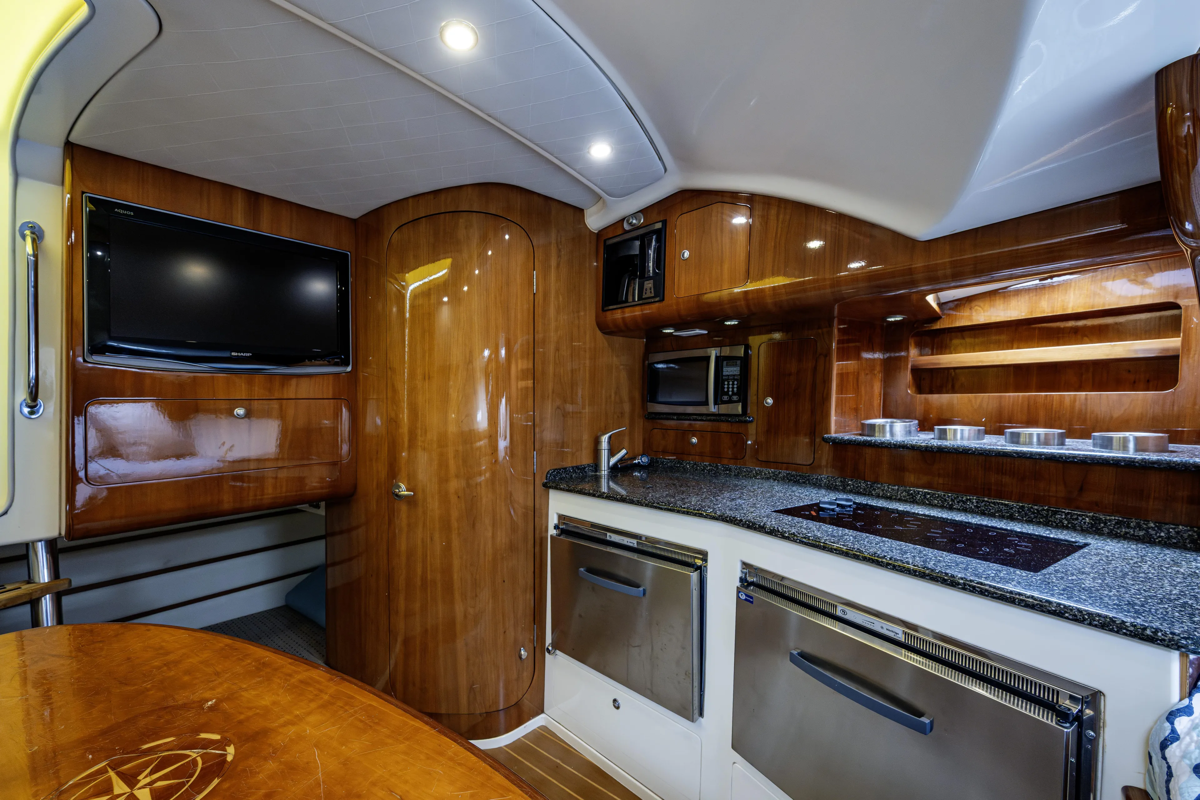 5 O' Clock Somewhere Yacht Photos Pics Luxurious interior of 2010 Scout 350 Abaco boat with modern kitchen amenities.