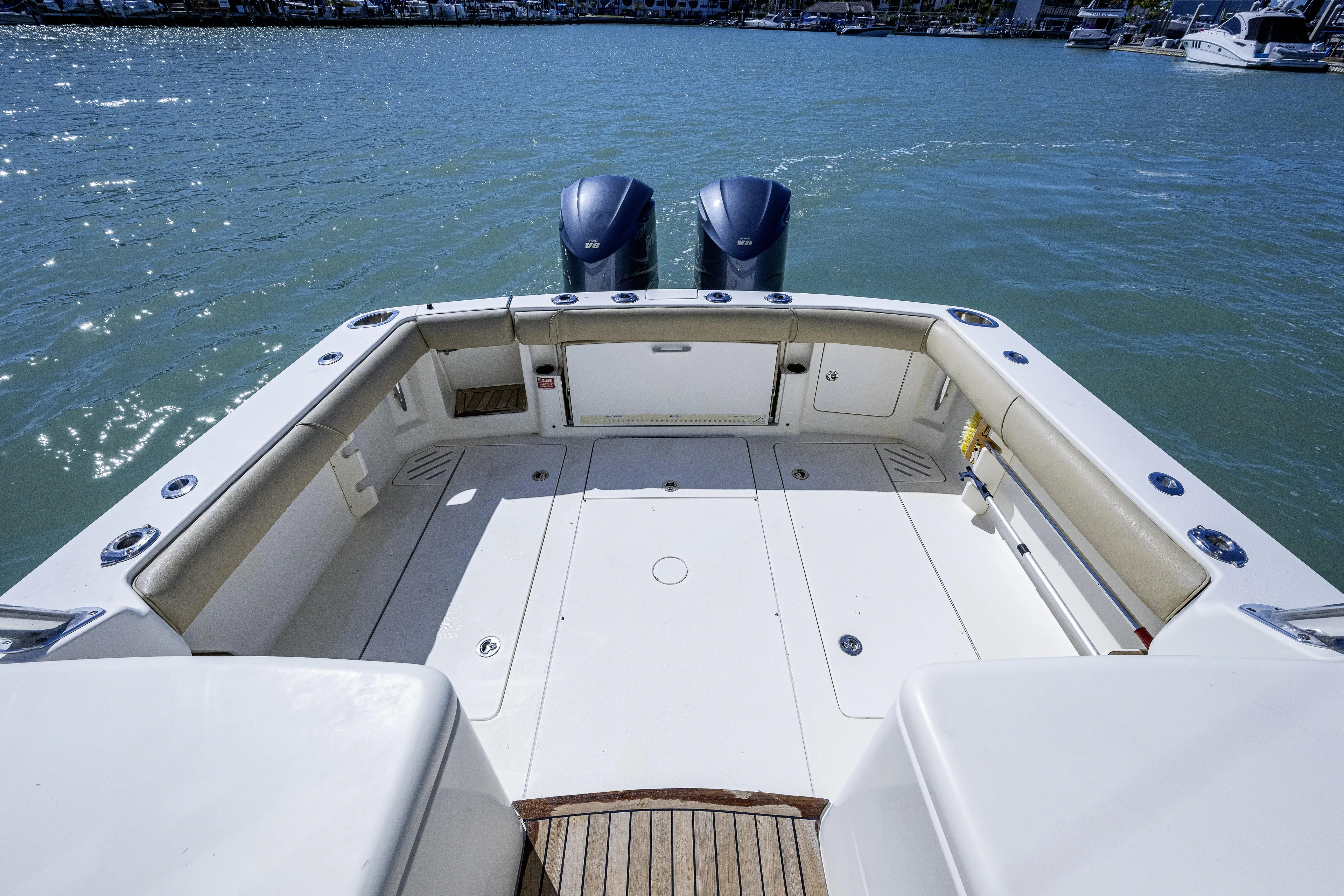 5 O' Clock Somewhere Yacht Photos Pics 2010 Scout 350 Abaco boat deck with twin engines on calm water.