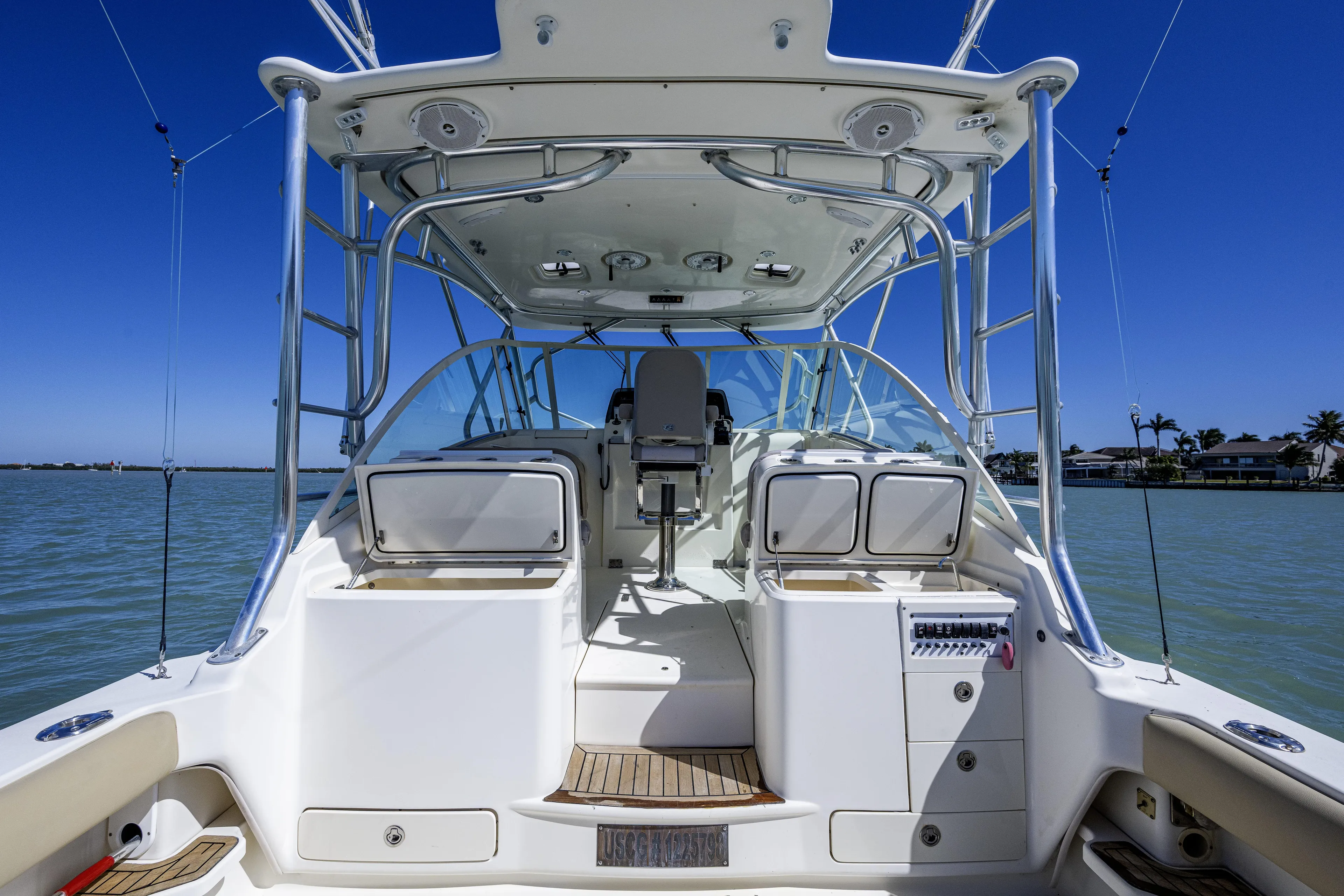 5 O' Clock Somewhere Yacht Photos Pics 2010 Scout 350 Abaco boat interior with helm, seating, and storage compartments.