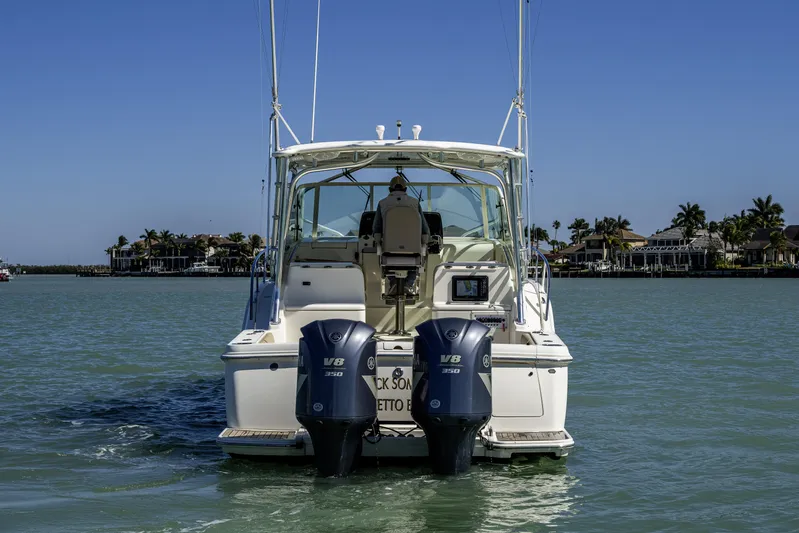5 O' Clock Somewhere Yacht Photos Pics 2010 Scout 350 Abaco boat with dual V8 engines on calm water.
