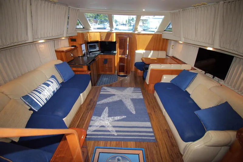 IV Play Too Yacht Photos Pics Luxurious interior of 2005 Carver 444 Cockpit Motor Yacht with blue and beige decor.