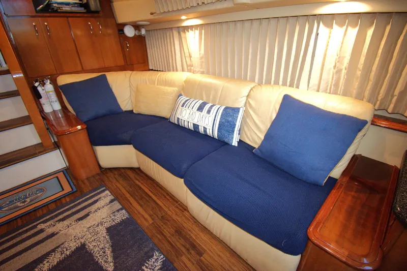 IV Play Too Yacht Photos Pics Luxurious interior of 2005 Carver 444 Cockpit Motor Yacht with plush seating and elegant decor.