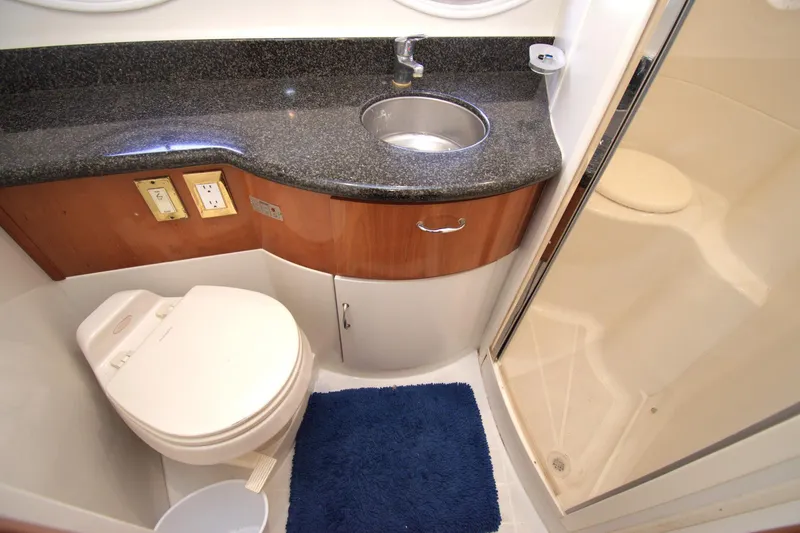 IV Play Too Yacht Photos Pics Bathroom interior of 2005 Carver 444 Cockpit Motor Yacht with sink, toilet, and shower.