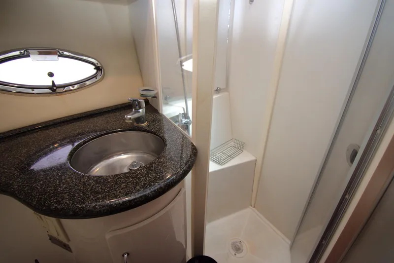 IV Play Too Yacht Photos Pics Bathroom interior of 2005 Carver 444 Cockpit Motor Yacht with sink and shower.