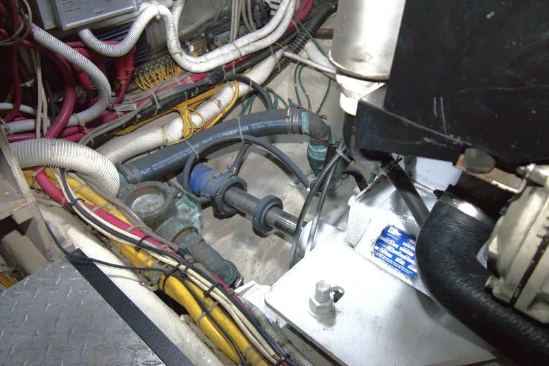 IV Play Too Yacht Photos Pics Engine compartment of 2005 Carver 444 Cockpit Motor Yacht with visible wiring and hoses.