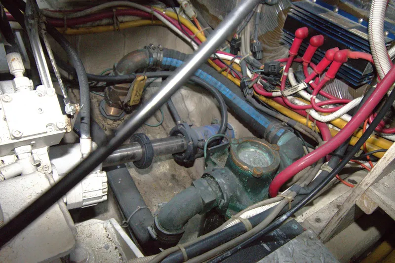 IV Play Too Yacht Photos Pics Engine compartment of a 2005 Carver 444 Cockpit Motor Yacht with visible wiring and components.