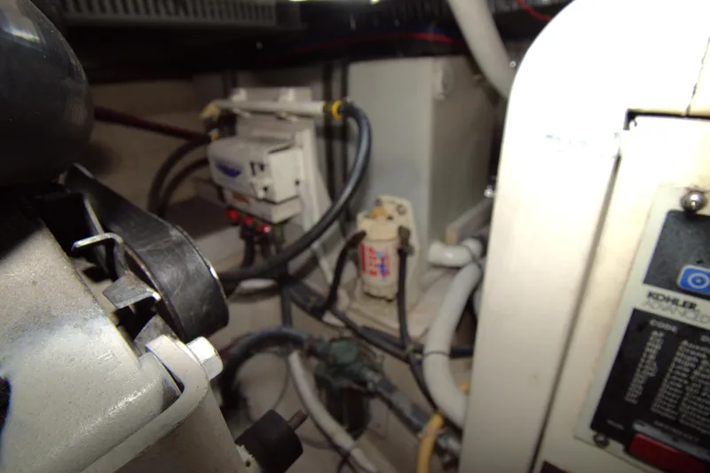 IV Play Too Yacht Photos Pics Engine room of 2005 Carver 444 Cockpit Motor Yacht with Kohler generator.