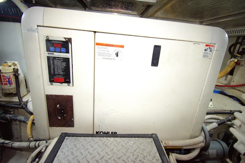 IV Play Too Yacht Photos Pics Engine room of 2005 Carver 444 Cockpit Motor Yacht with Kohler generator.