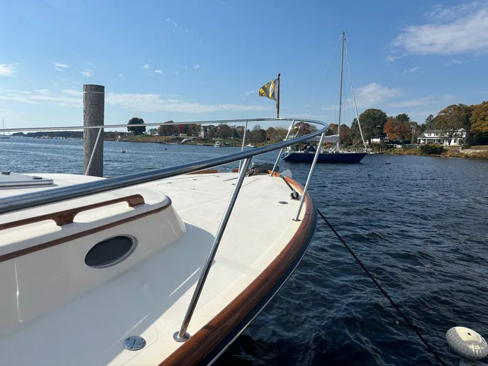 Mallard Yacht Photos Pics 2005 Hinckley Talaria 44 MY yacht docked on a sunny day, with scenic waterfront view.