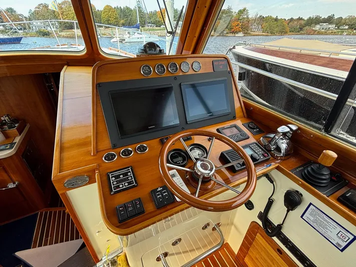 Mallard Yacht Photos Pics Helm of 2005 Hinckley Talaria 44 MY with wooden dashboard and dual screens.