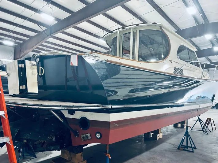 Mallard Yacht Photos Pics 2005 Hinckley Talaria 44 MY yacht in a warehouse, elevated on blocks.