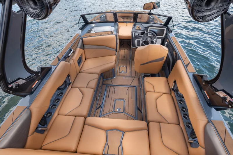  Yacht Photos Pics Luxurious interior of 2025 Centurion Nv233 boat with tan leather seating on water.
