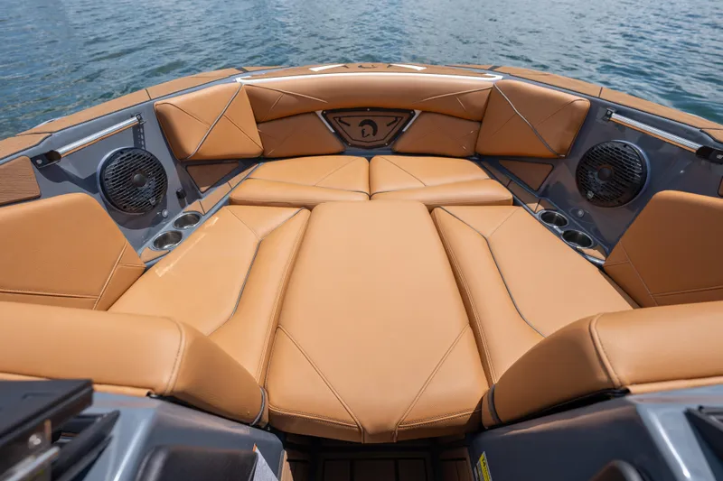  Yacht Photos Pics Luxurious interior of 2025 Centurion Nv233 boat with tan leather seating and speakers.