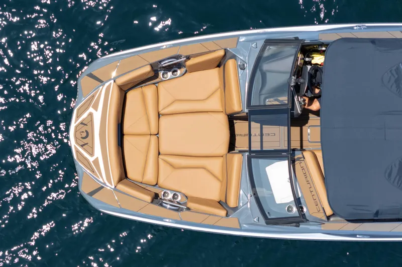  Yacht Photos Pics Overhead view of 2025 Centurion Nv233 boat with tan seating on water.