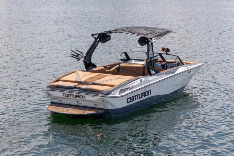  Yacht Photos Pics 2025 Centurion Nv233 boat on calm water, featuring sleek design and modern amenities.